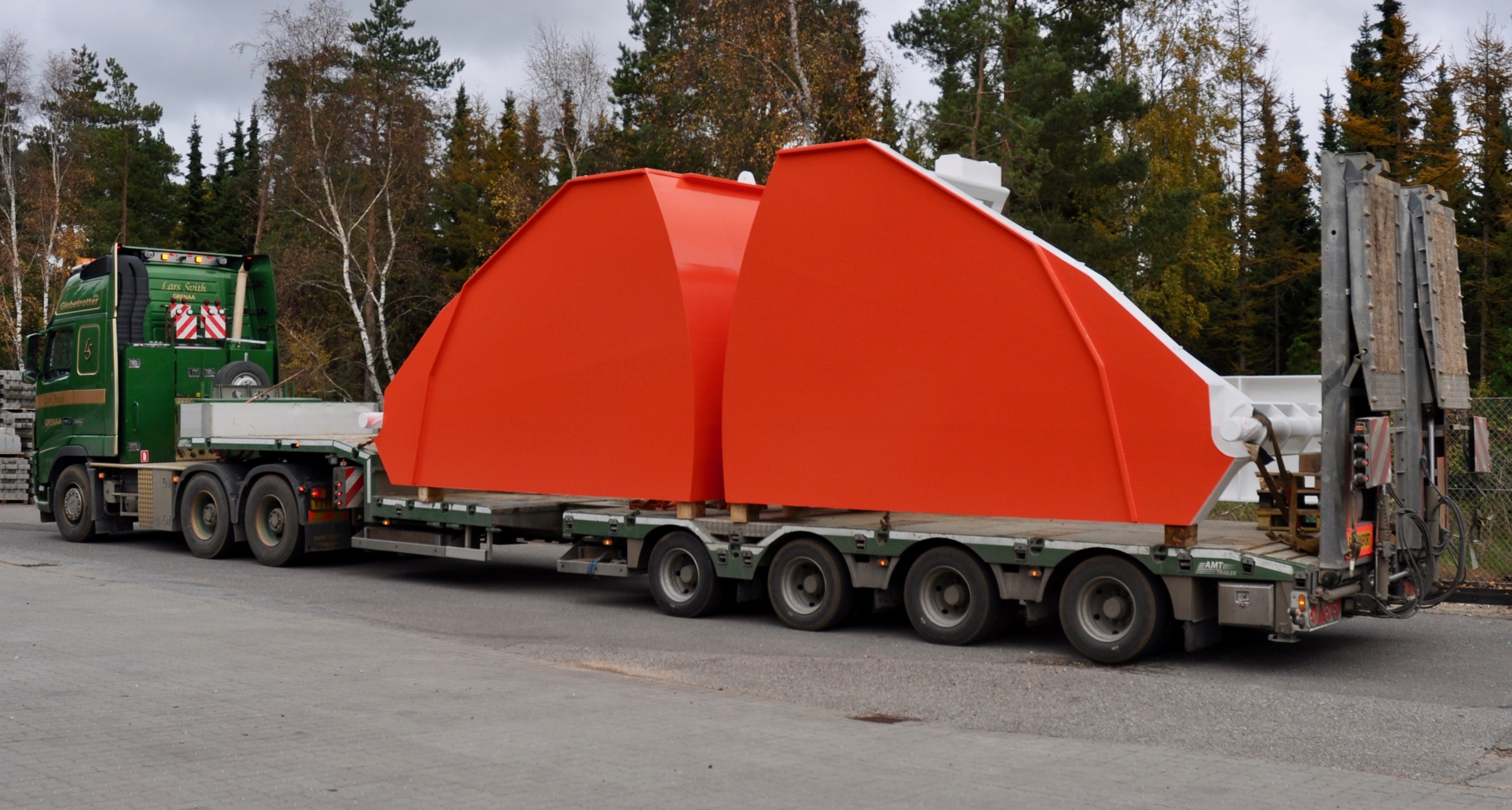 Painted offshore bow door on transport; historical work in progress, 2018